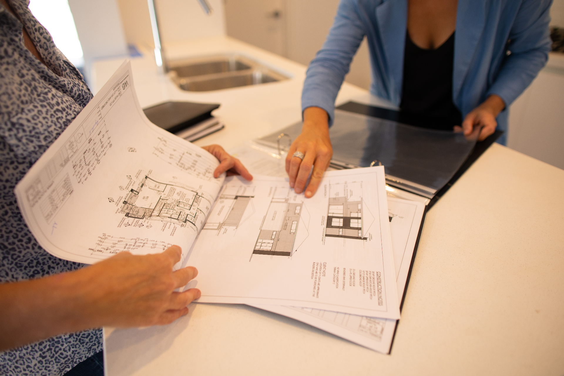 Pulse team reviewing architectural plans for a Western Australian development